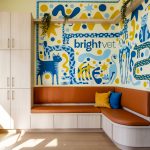 Office lobby with colorful mural of cats and dogs